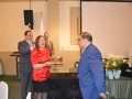 Parishioner and honoree Linda Dvelis surprises her brother, fellow honoree Bobby Shwaery, with a birthday cake to celebrate his 70th birthday.